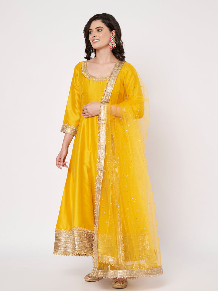 anokherang Combos Radiant Mustard Silk Anarkali with Pants and Bridal Net Embellished Dupatta