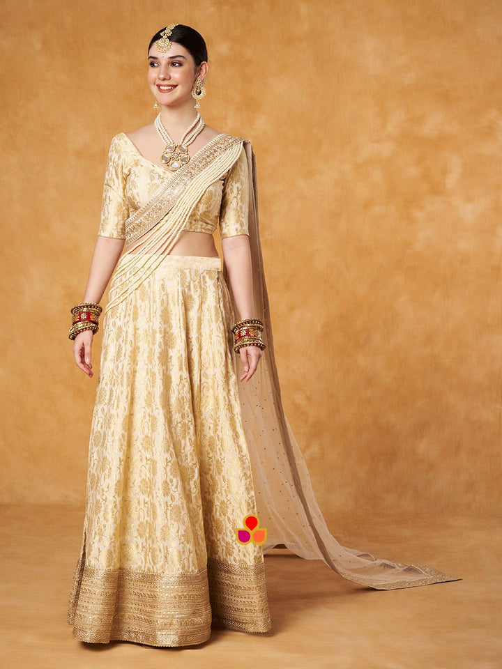 anokherang Lehenga Ivory Gold Banarsi Silk Lehenga Choli with Pearl Hand Embroidered Net Dupatta