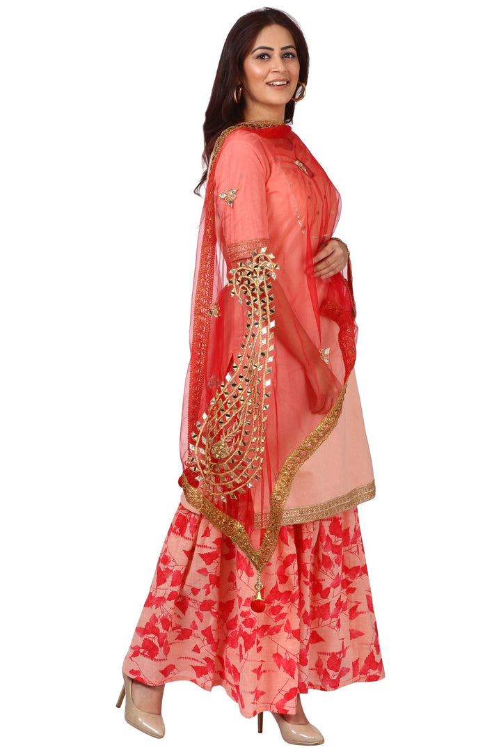 anokherang Combos Peach Peephole Short Kurti with Printed Gharara and Red Net Mirror Paisley Dupatta