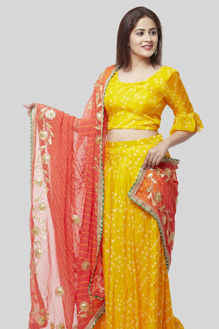 anokherang Lehenga Sunshine Yellow Bandhej Ruffle Lehenga Choli with Peachy Orange Leheriya Dupatta