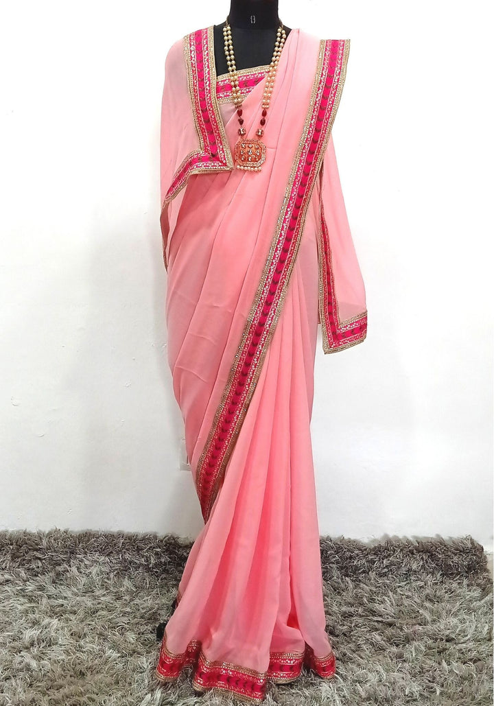 anokherang Sarees Splendid Pink Embroidered Border Georgette Saree